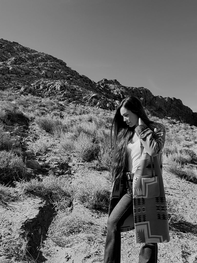 Tennille walking in the desert black and white photo